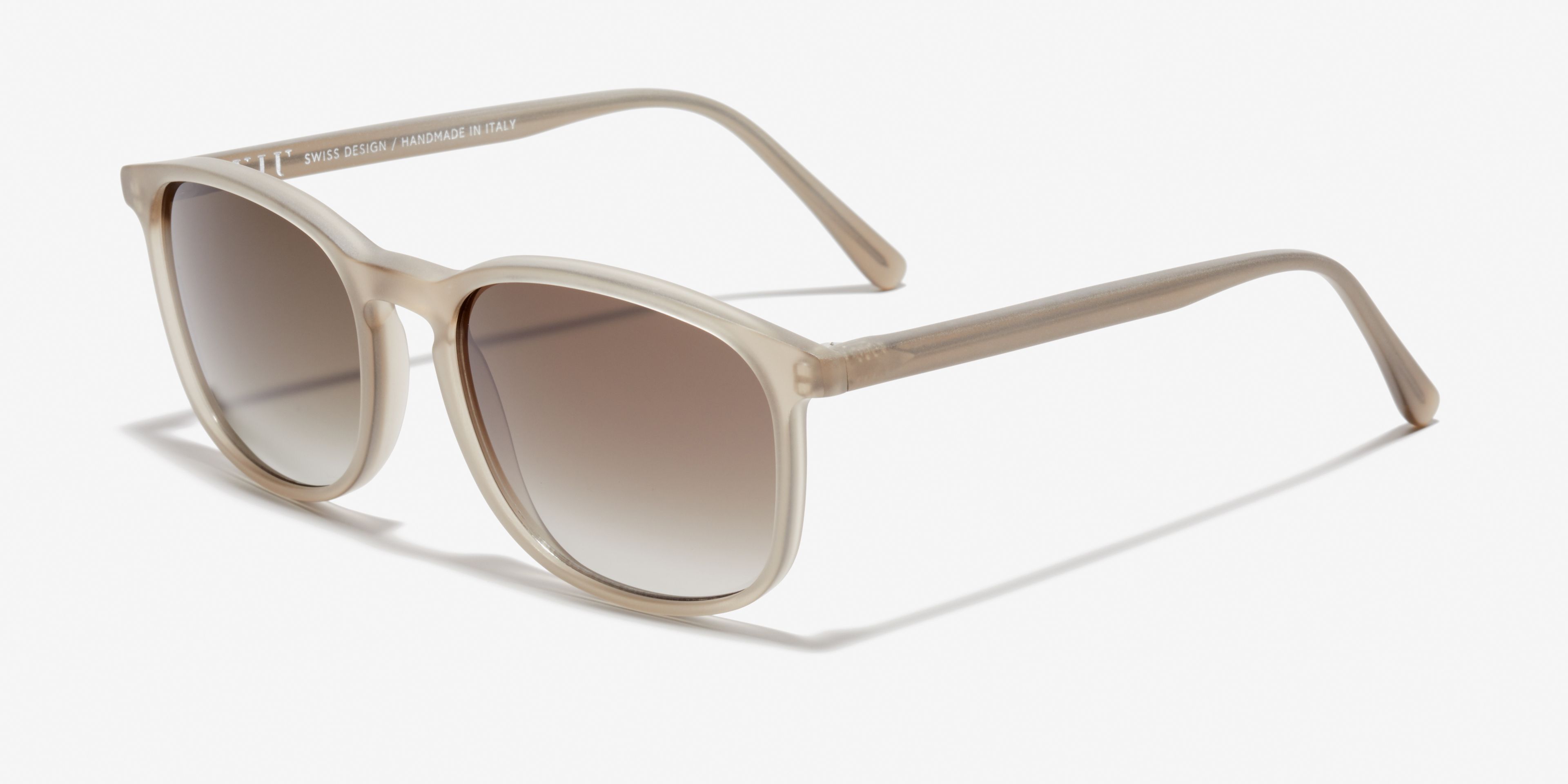 Angle image of the sunglasses The Polished in colour Stone Grey Transparent and size Wide