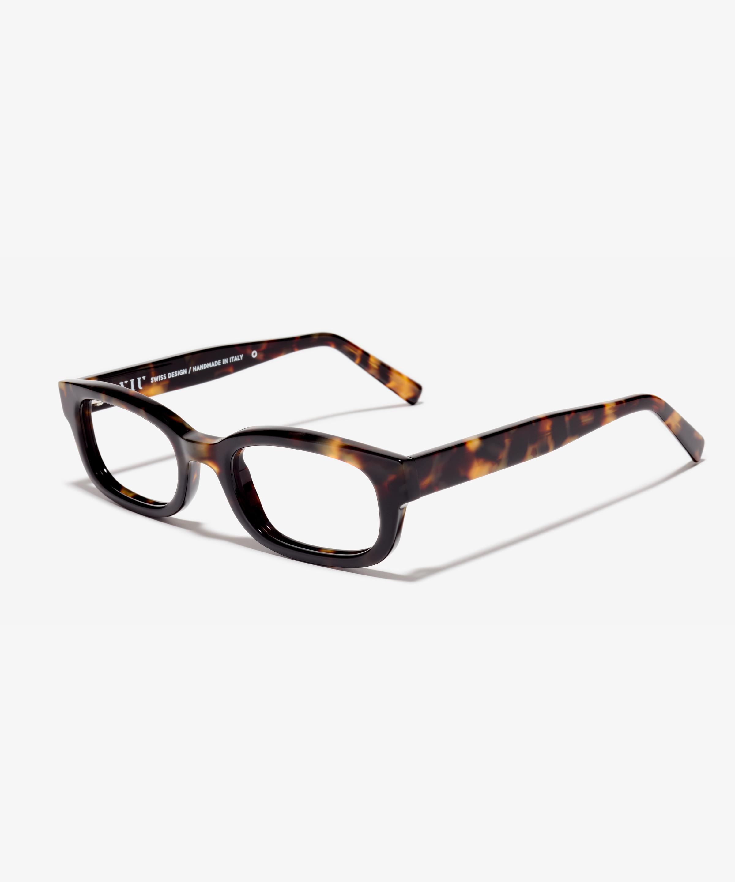 Schräg-Bild der Brille The Shameless in Farbe Amber Tortoise und Größe Breit