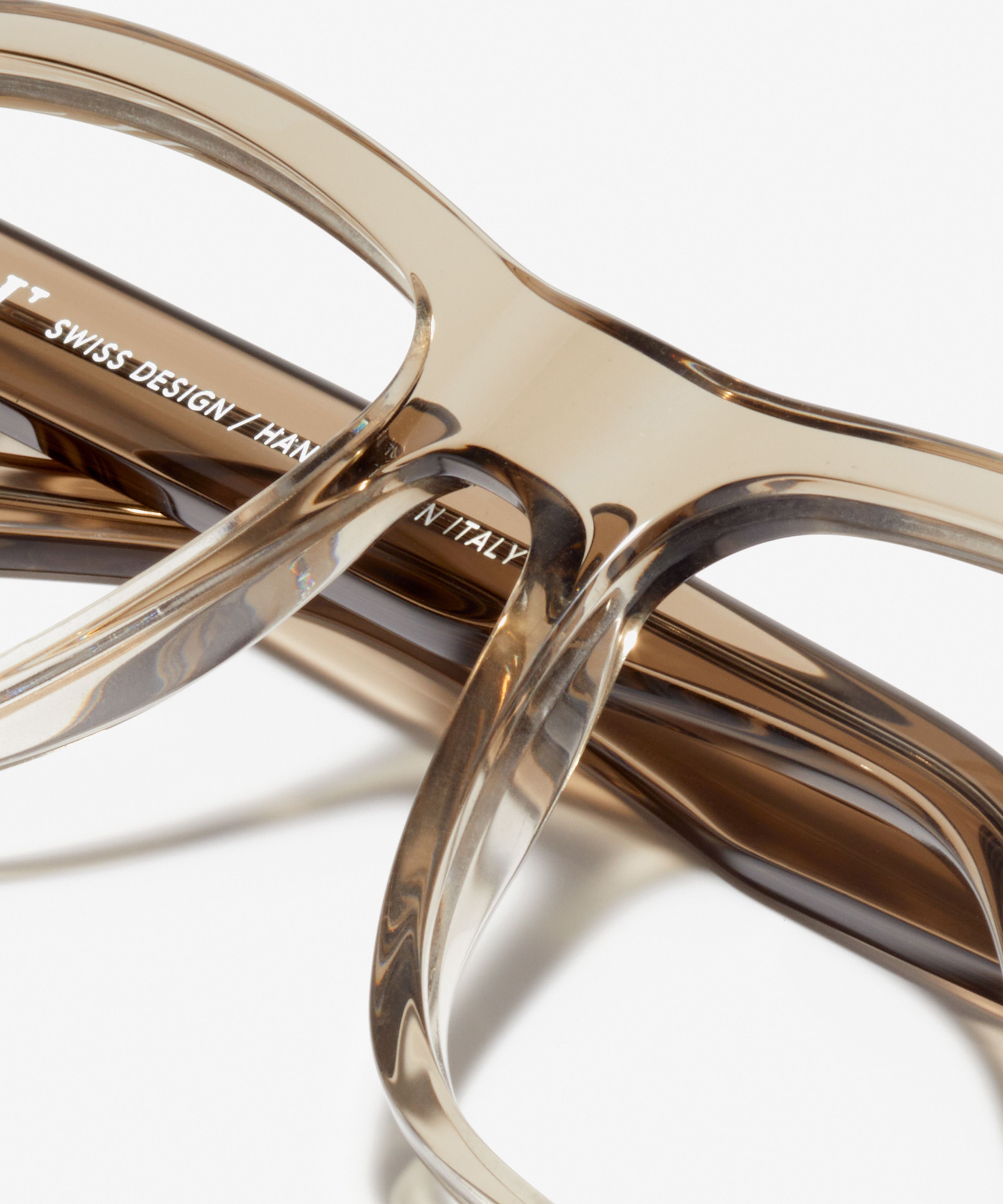 Detail image of the frame The Marvelous in colour Stone Grey Transparent and size Wide