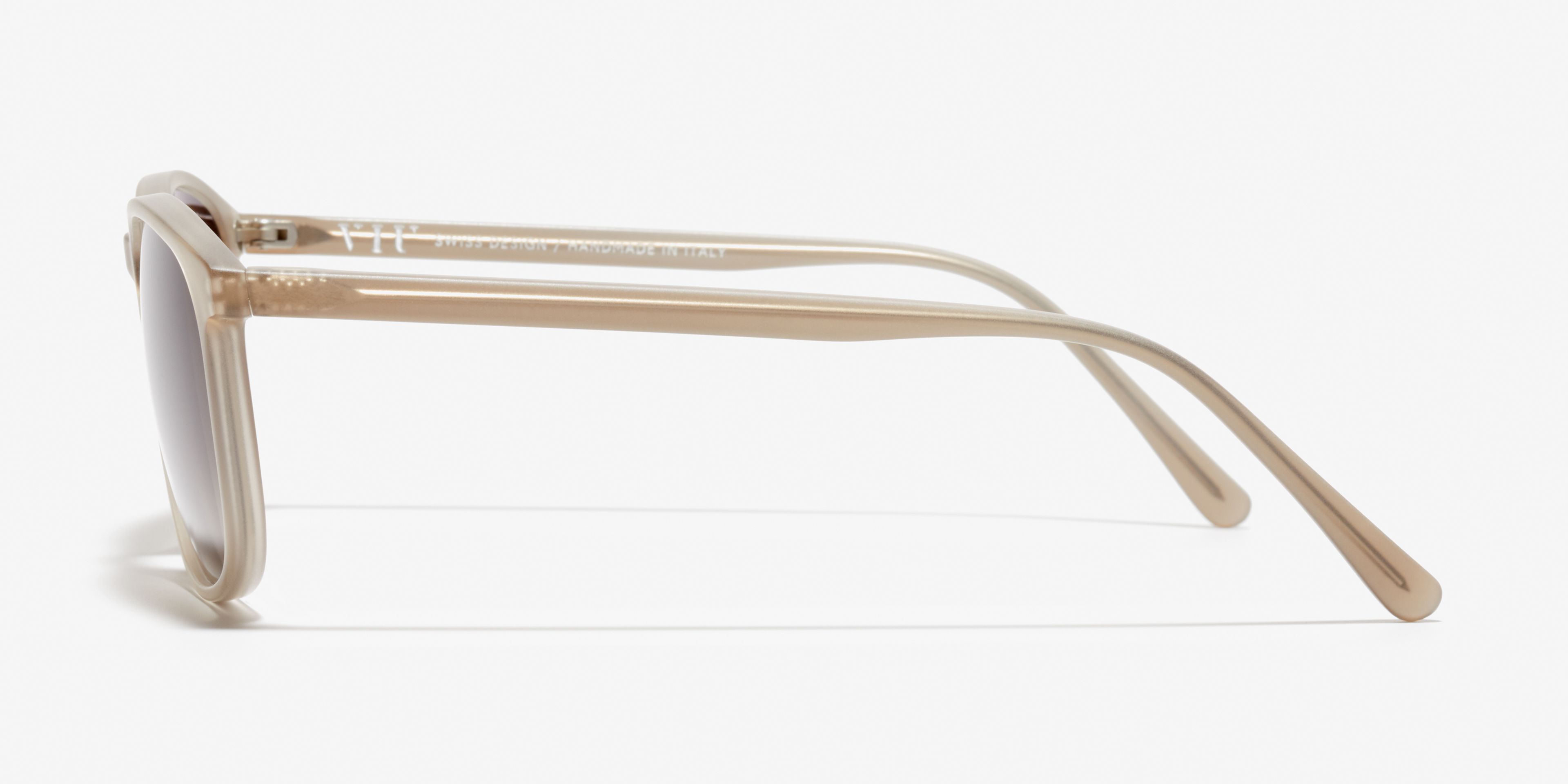 Side image of the sunglasses The Polished in colour Stone Grey Transparent and size Wide
