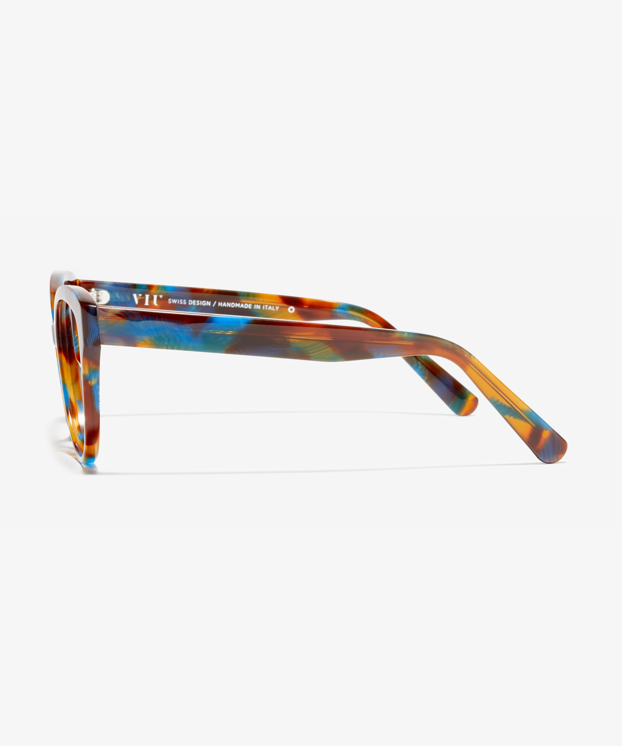 Side image of the frame The Cosmopolitan in colour Blue Tortoise and size Wide